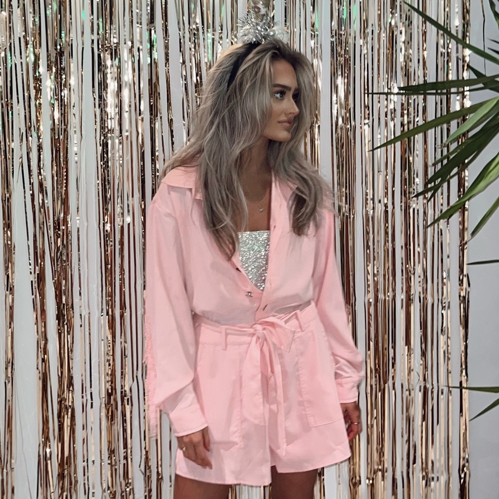 Pink romper with tassels small